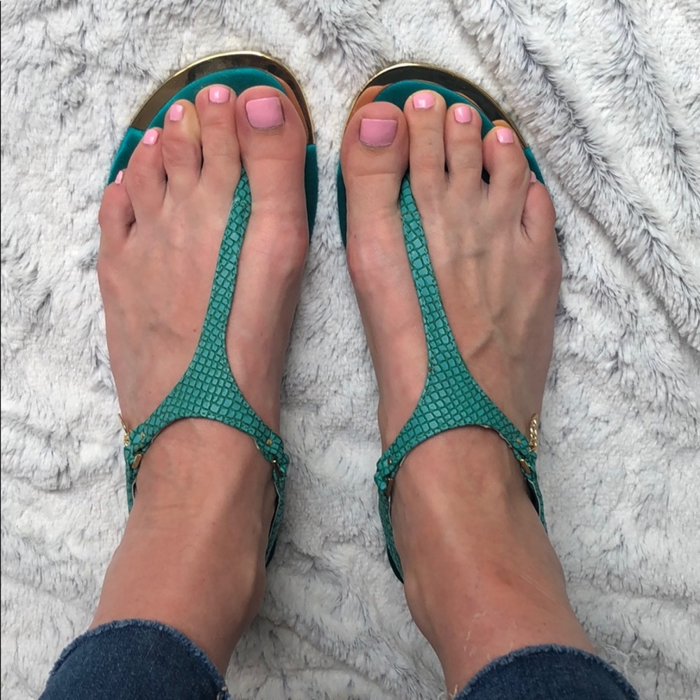 Teal sandals with gold trim and satin bottoms